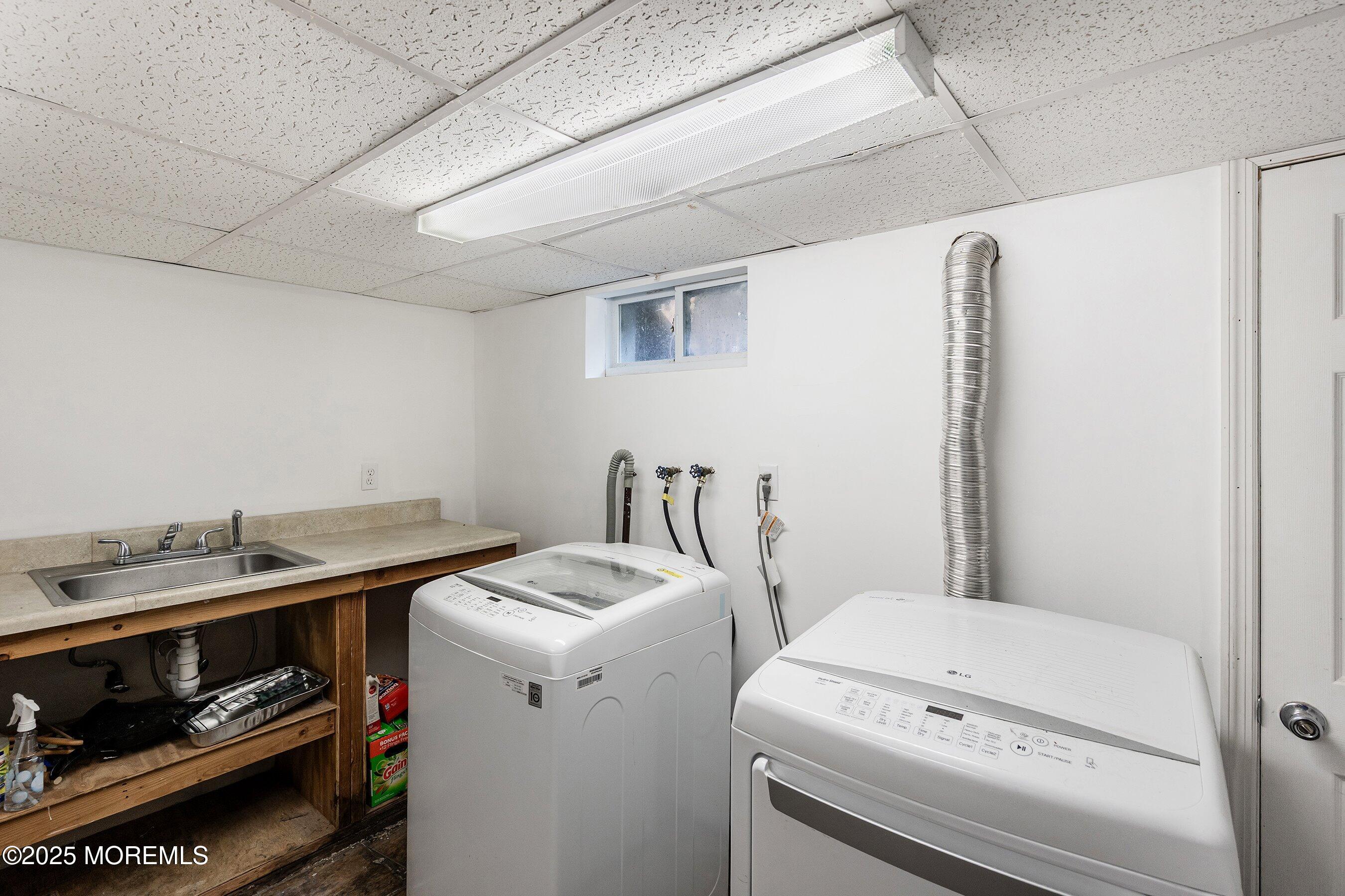 13 Rhode Island Drive Jackson, NJ 08527 - Photo 23 of 30 a utility room with dryer and washer