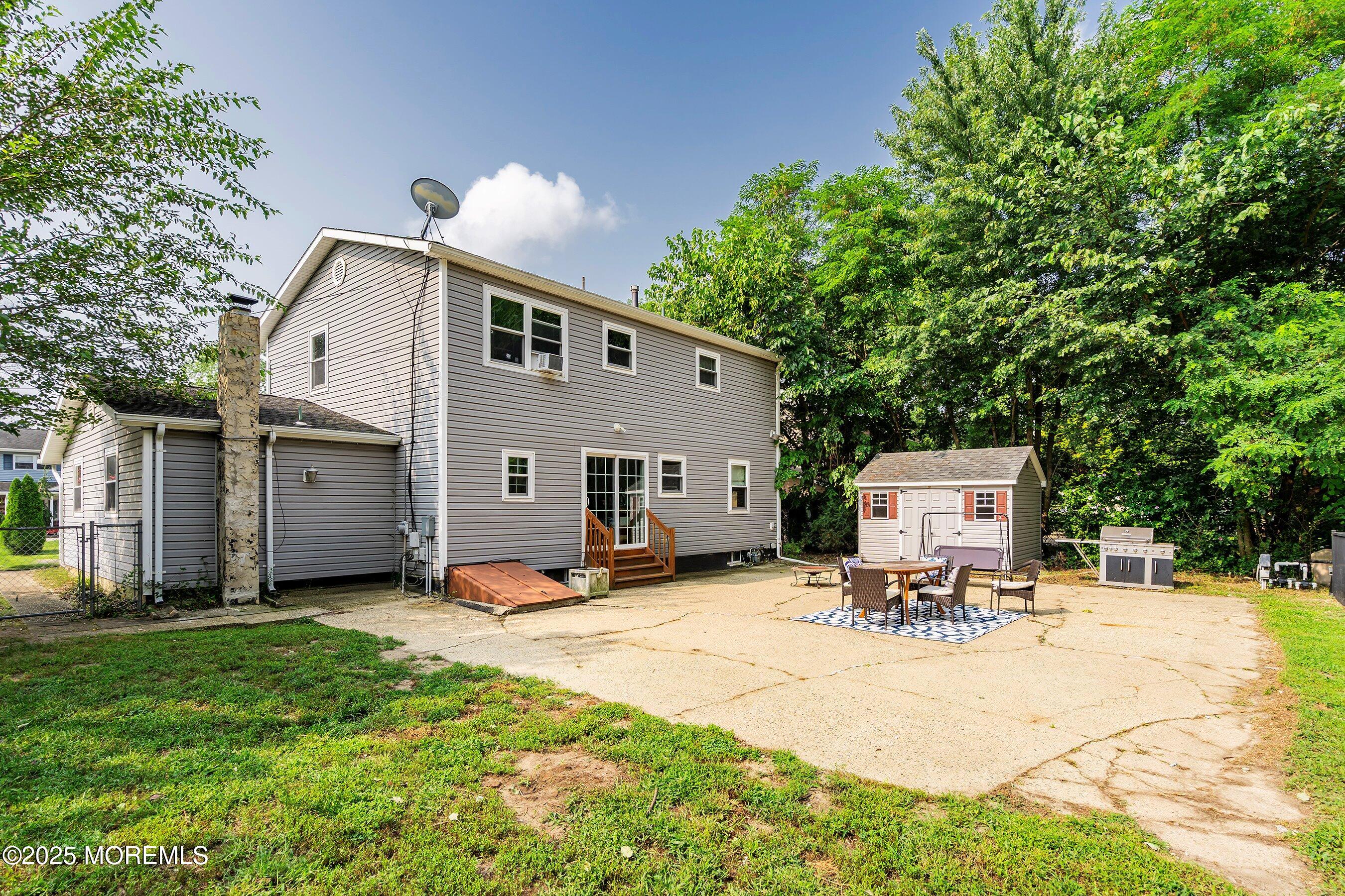 13 Rhode Island Drive Jackson, NJ 08527 - Photo 27 of 30 a view of a backyard with sitting area and furniture
