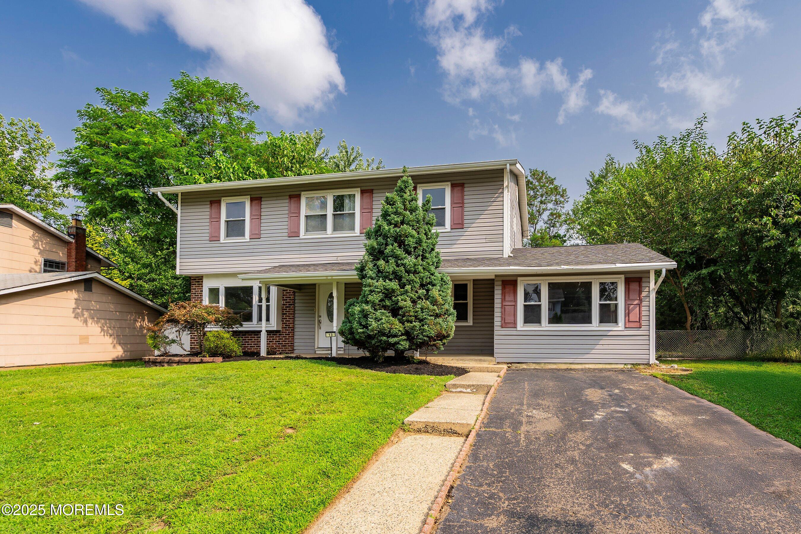 13 Rhode Island Drive Jackson, NJ 08527 - Photo 3 of 30 a front view of house with yard and green space