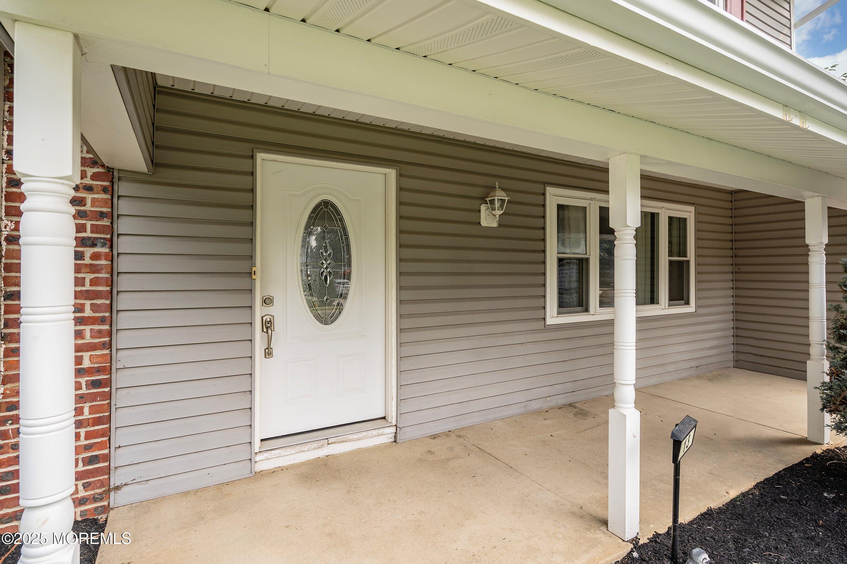13 Rhode Island Drive Jackson, NJ 08527 - Photo 4 of 30 a front view of a house with white door
