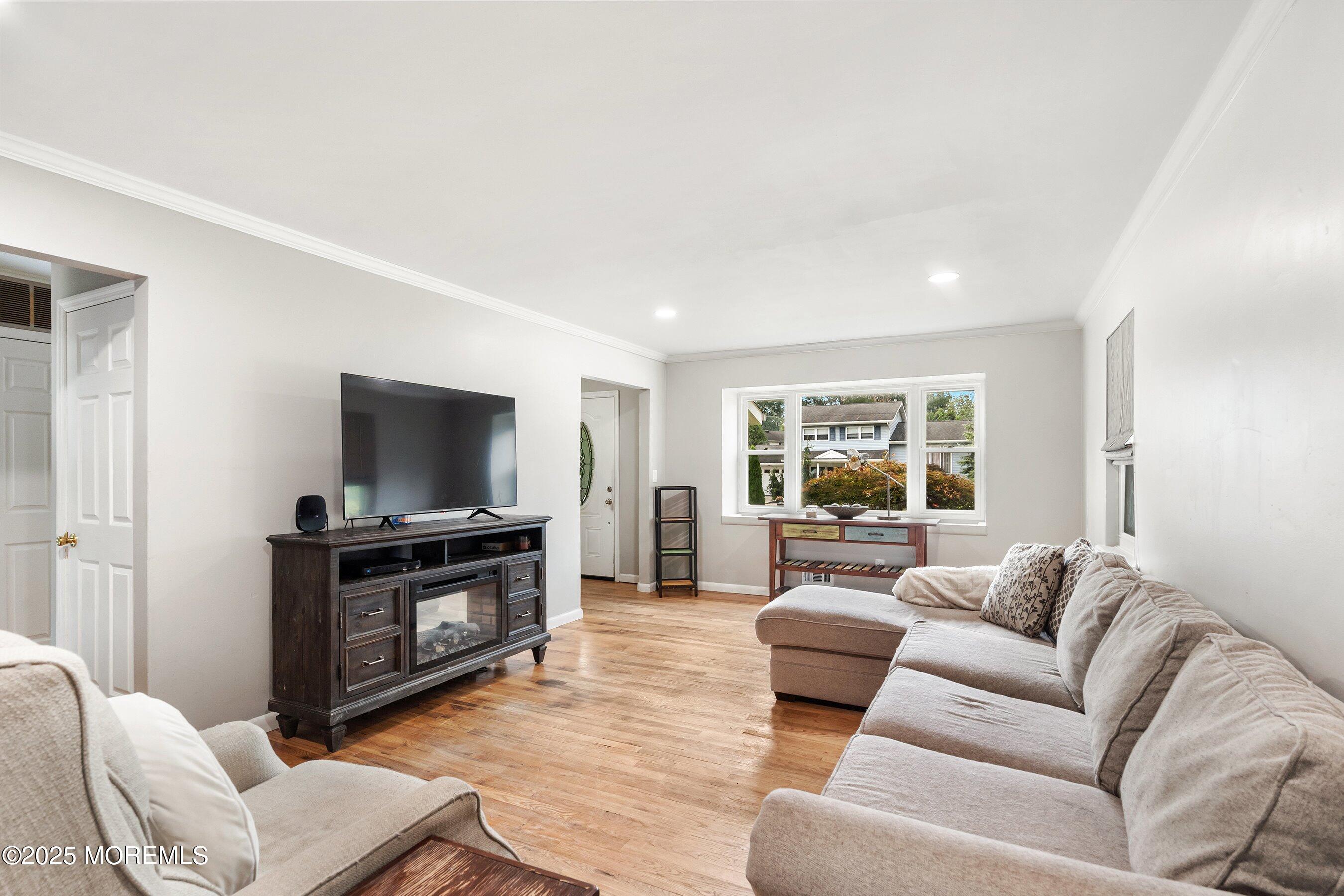13 Rhode Island Drive Jackson, NJ 08527 - Photo 5 of 30 a living room with furniture and a flat screen tv
