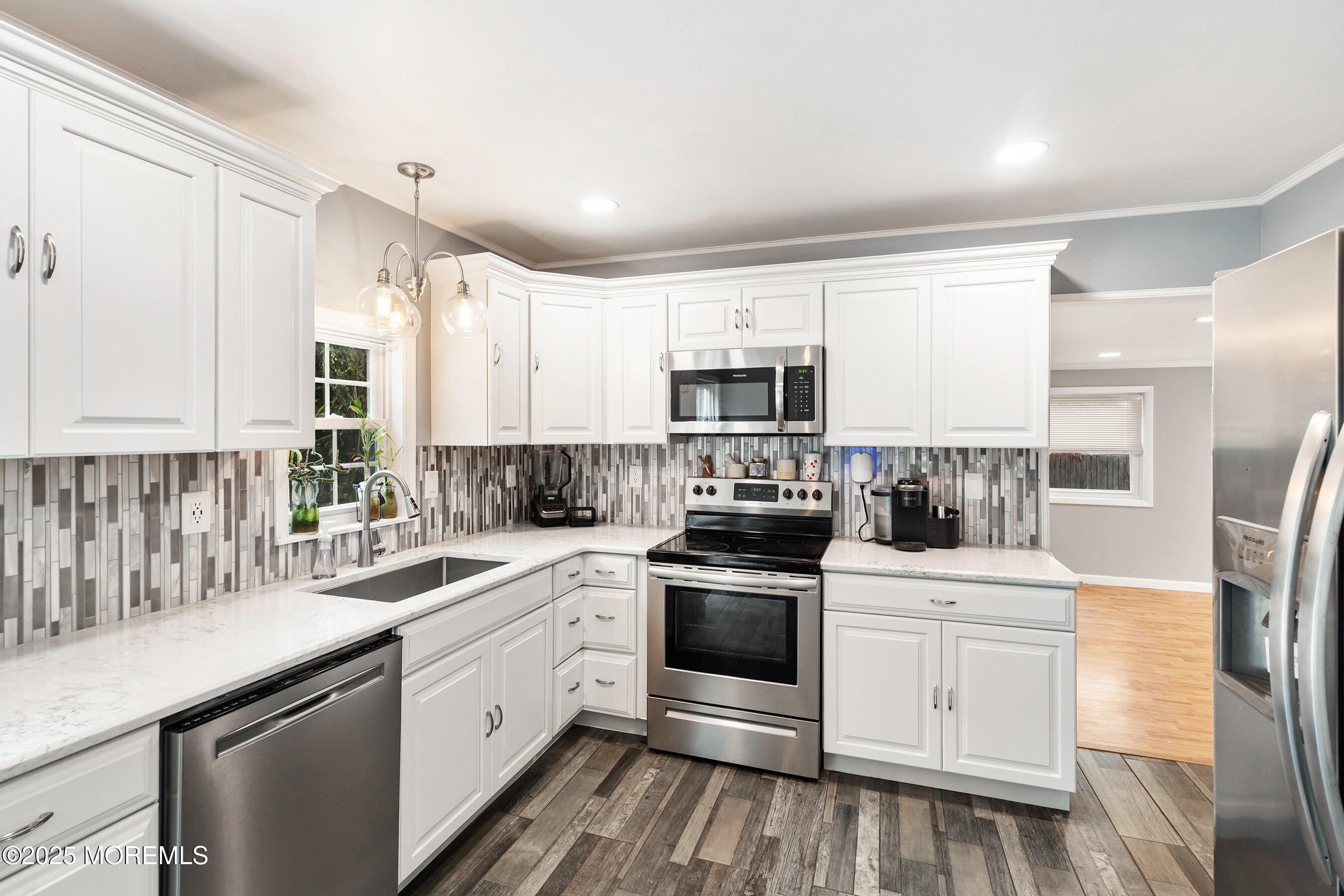 13 Rhode Island Drive Jackson, NJ 08527 - Photo 8 of 30 a kitchen with white cabinets stainless steel appliances and sink