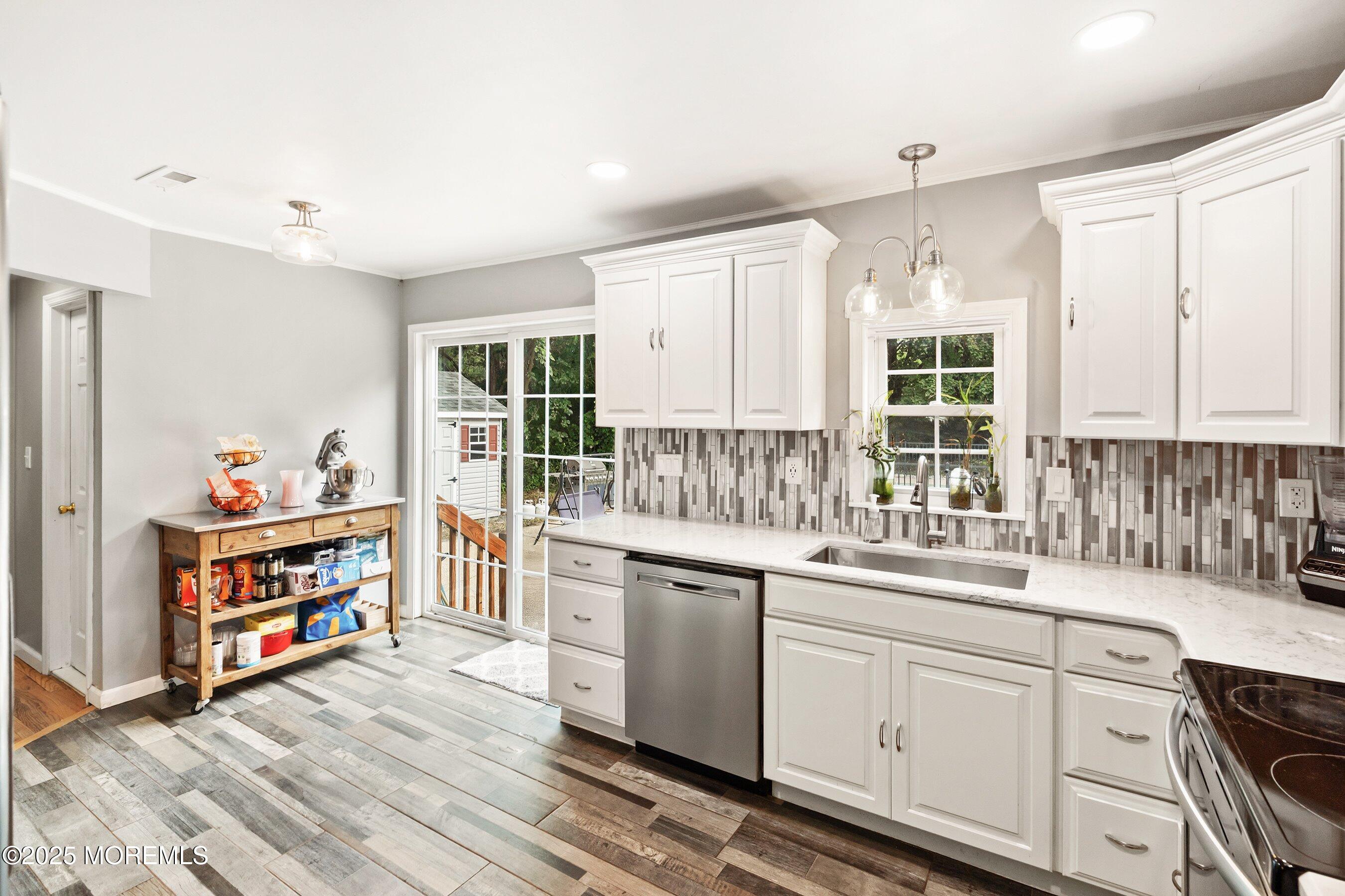 13 Rhode Island Drive Jackson, NJ 08527 - Photo 9 of 30 a kitchen that has a lot of cabinets in it and wooden floors