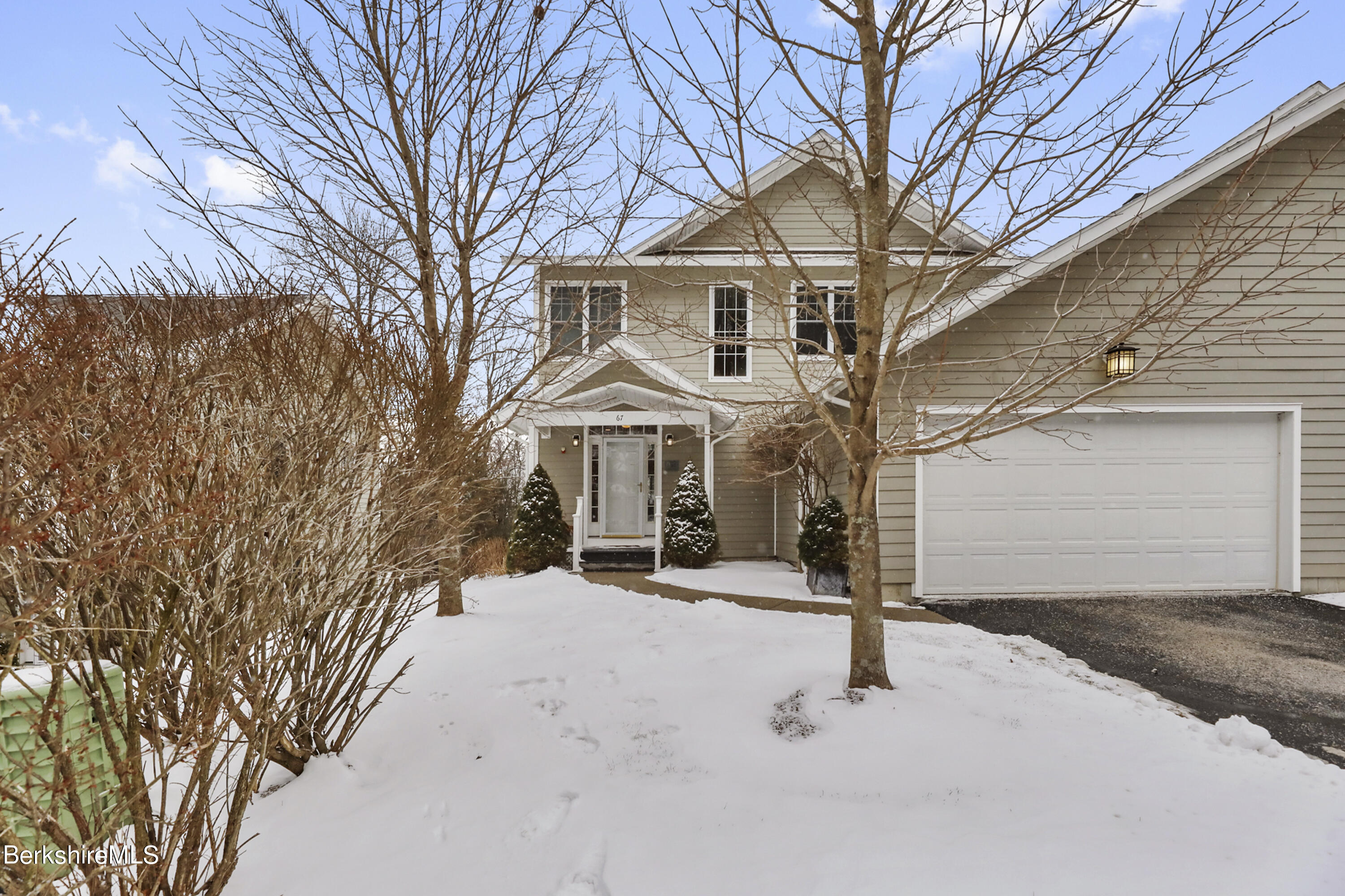 a front view of a building with parking space