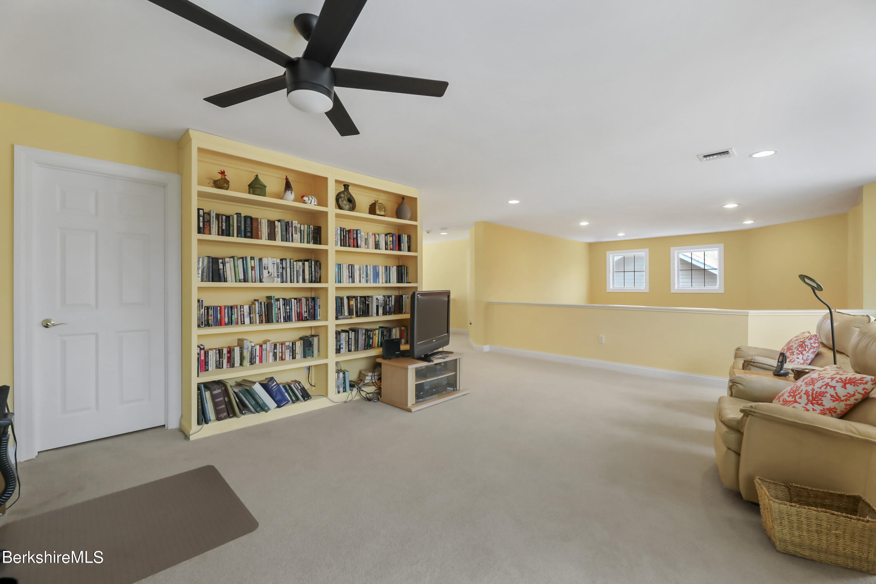 67 Alpine Trail Pittsfield, MA 01201 - Photo 17 of 40 a view of a livingroom with furniture and a ceiling fan
