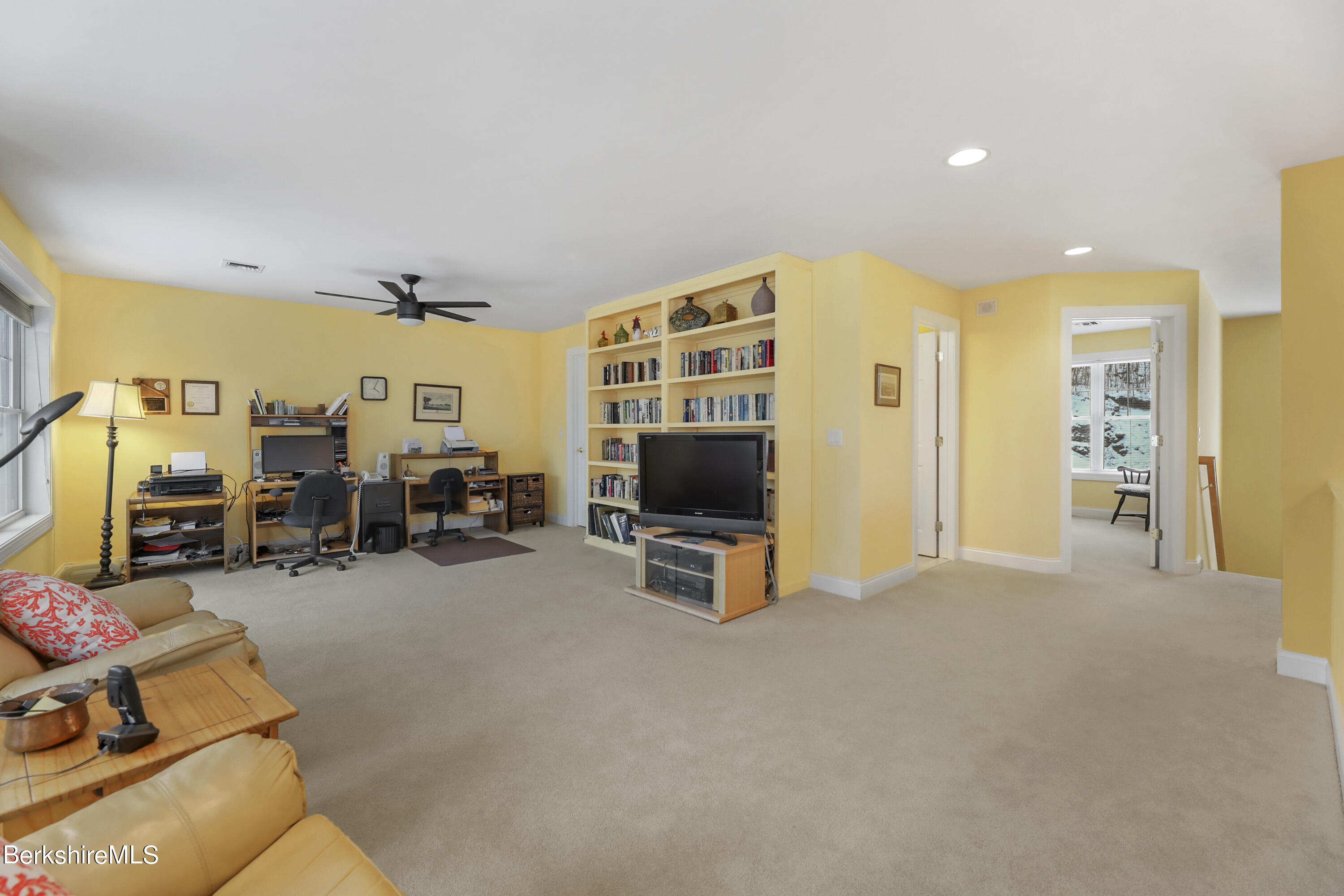 67 Alpine Trail Pittsfield, MA 01201 - Photo 18 of 40 a view of a livingroom with furniture and a flat screen tv