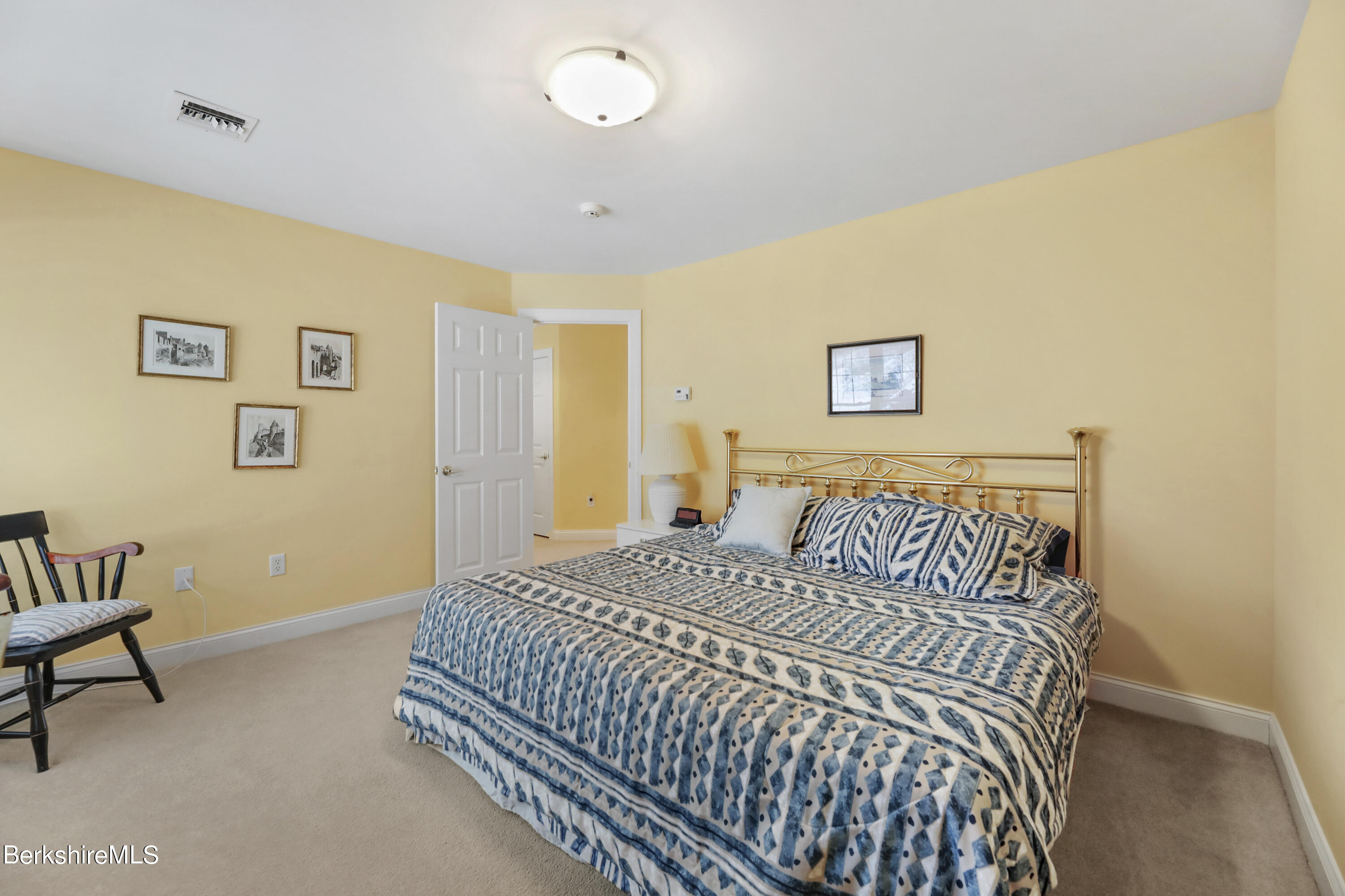 67 Alpine Trail Pittsfield, MA 01201 - Photo 20 of 40 a bedroom with a bed and a table