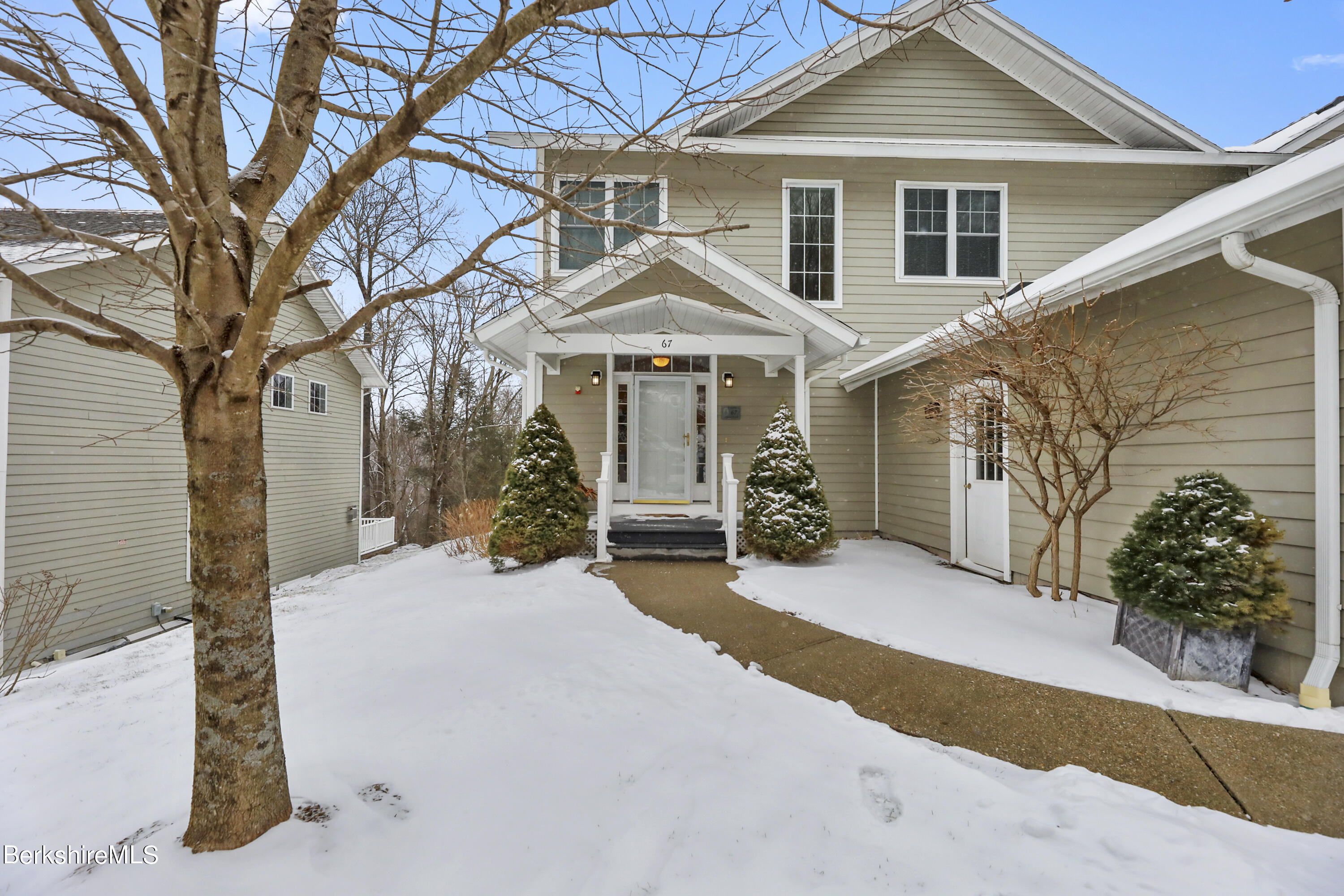 67 Alpine Trail Pittsfield, MA 01201 - Photo 2 of 40 a front view of a house with a yard and garage