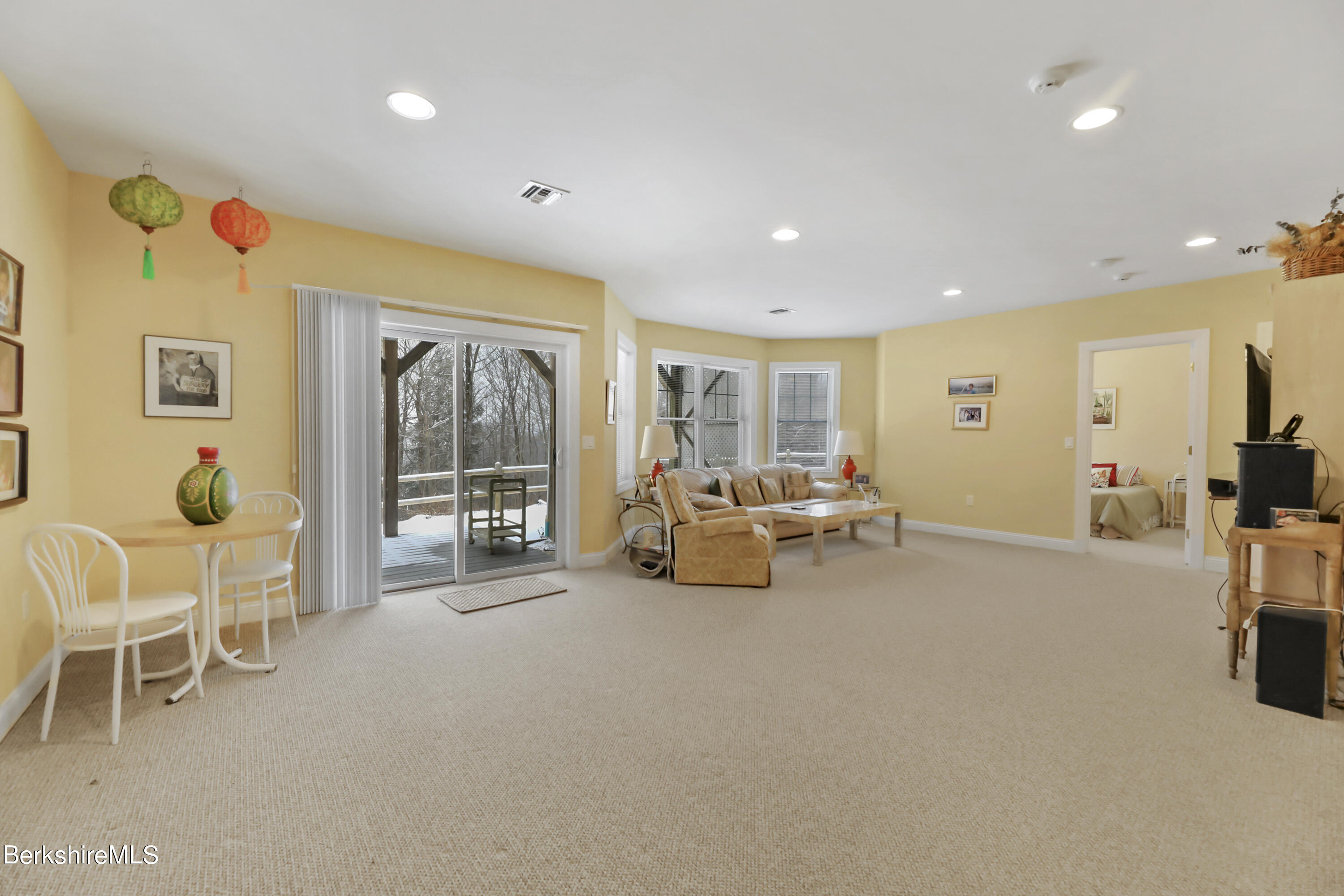 67 Alpine Trail Pittsfield, MA 01201 - Photo 25 of 40 a view of a livingroom with furniture and a flat screen tv