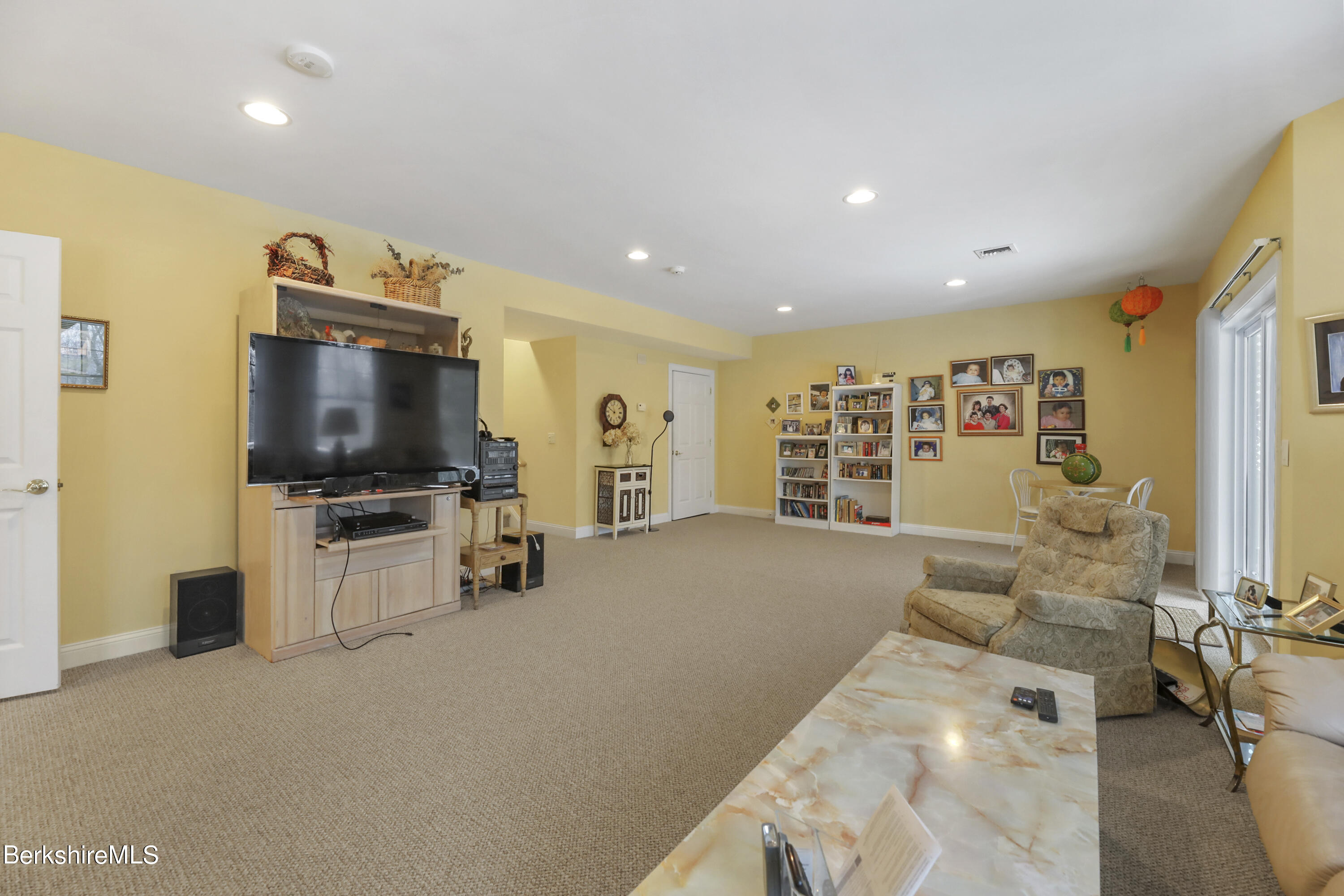 67 Alpine Trail Pittsfield, MA 01201 - Photo 27 of 40 a living room with stainless steel appliances furniture and a flat screen tv
