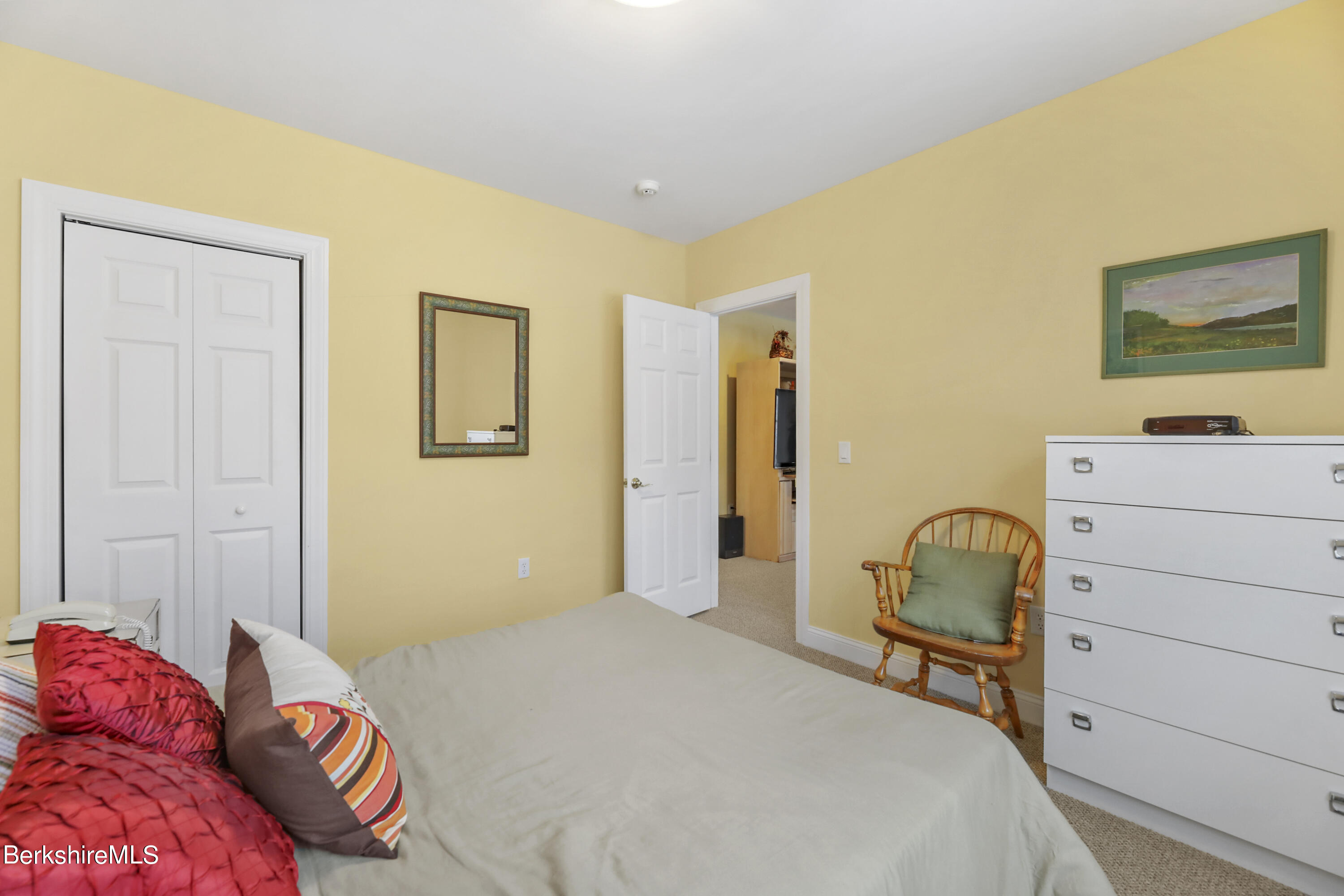 67 Alpine Trail Pittsfield, MA 01201 - Photo 29 of 40 a bedroom with a bed and a dresser