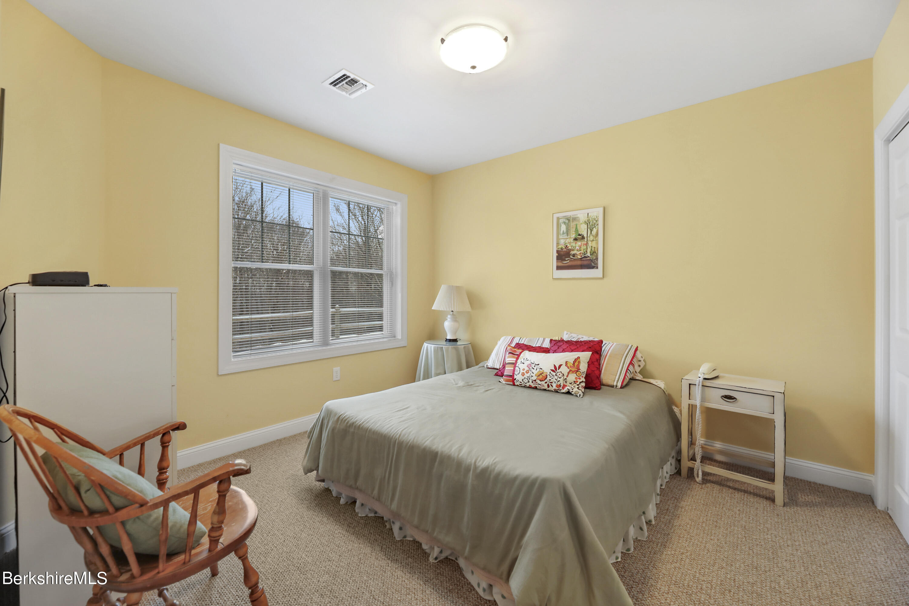 67 Alpine Trail Pittsfield, MA 01201 - Photo 30 of 40 a bedroom with a bed and a table in it