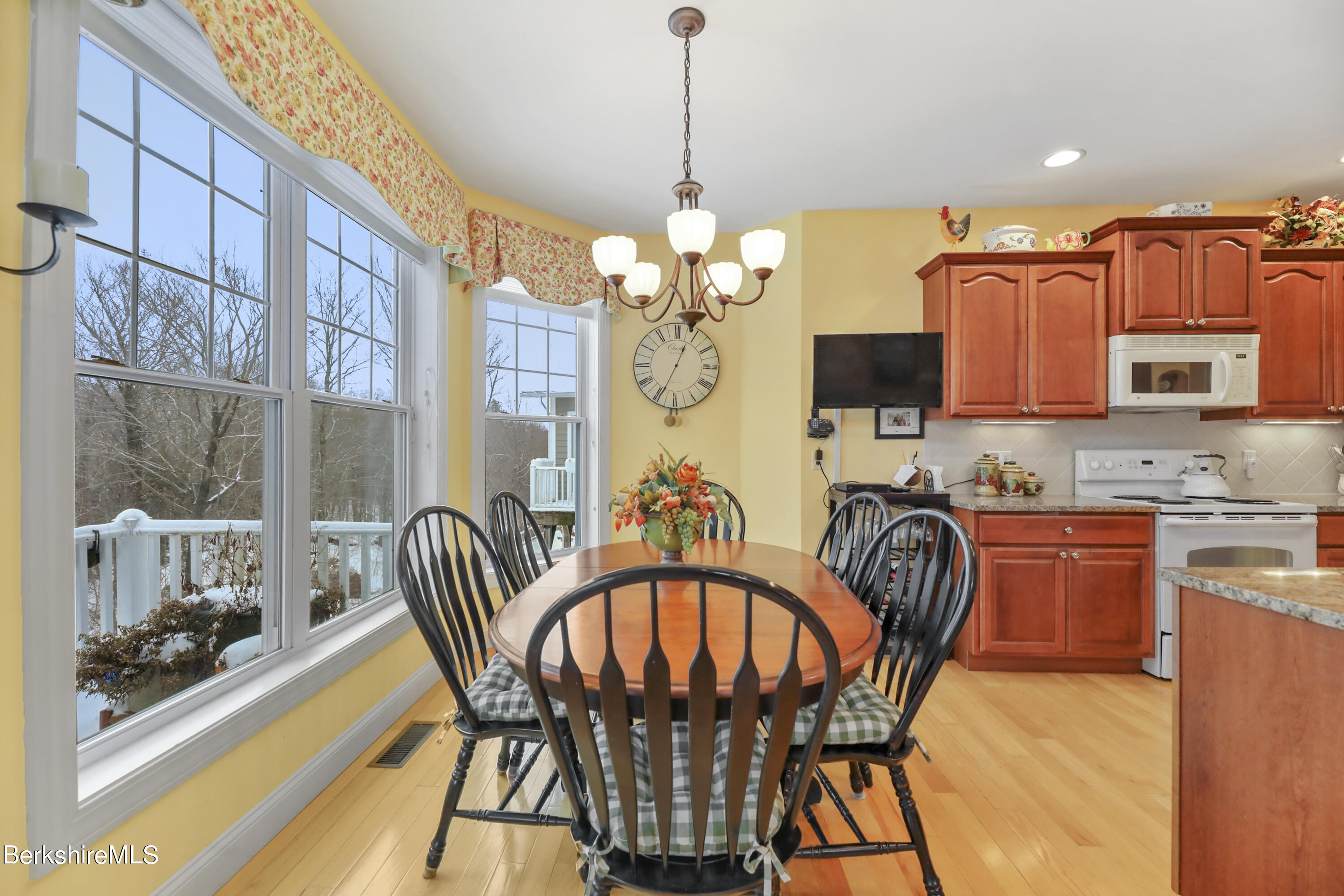 67 Alpine Trail Pittsfield, MA 01201 - Photo 7 of 40 a view of a dining room with furniture a chandelier and wooden floor