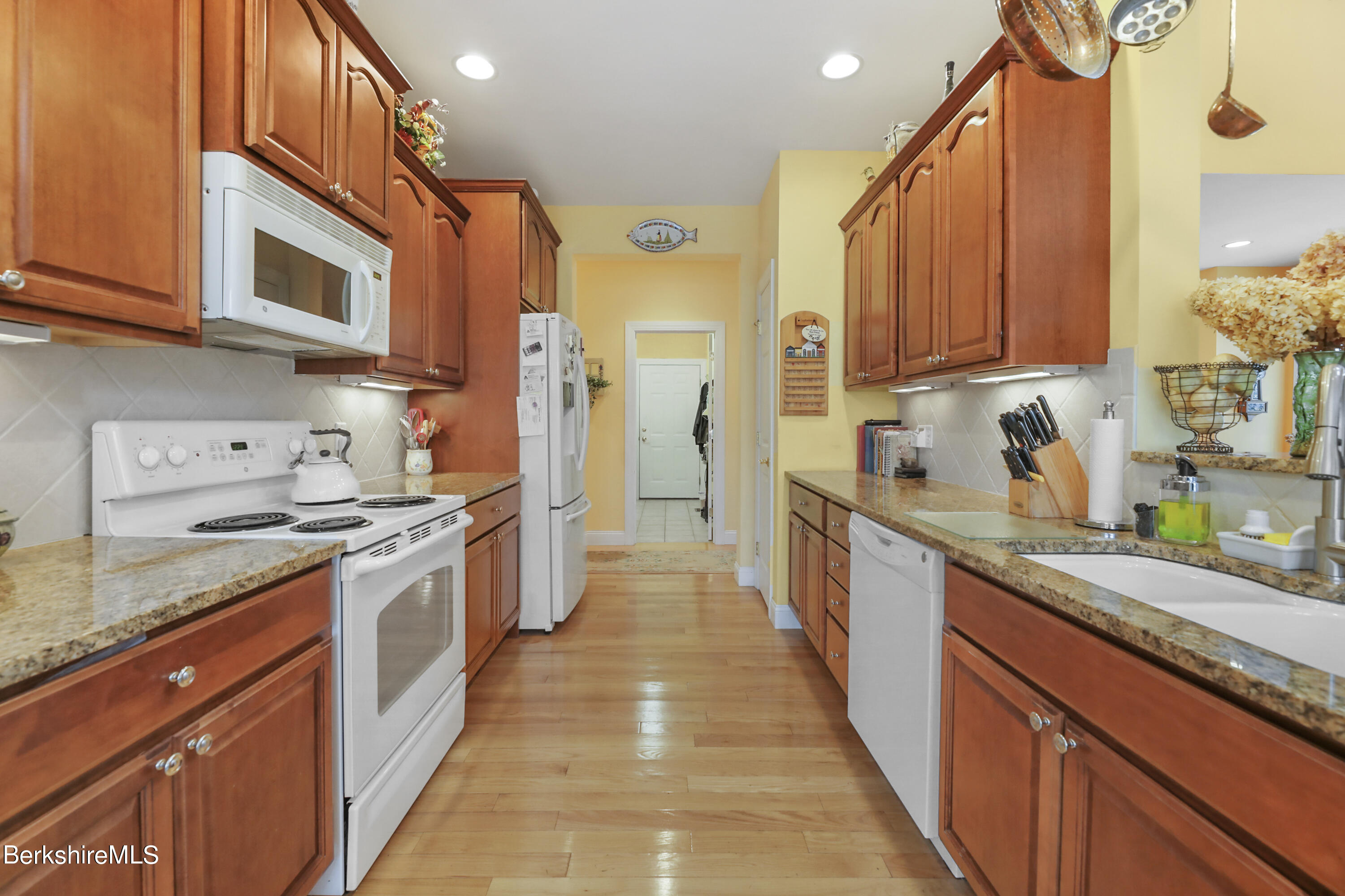 67 Alpine Trail Pittsfield, MA 01201 - Photo 8 of 40 a large kitchen with stainless steel appliances granite countertop a stove a sink and a microwave