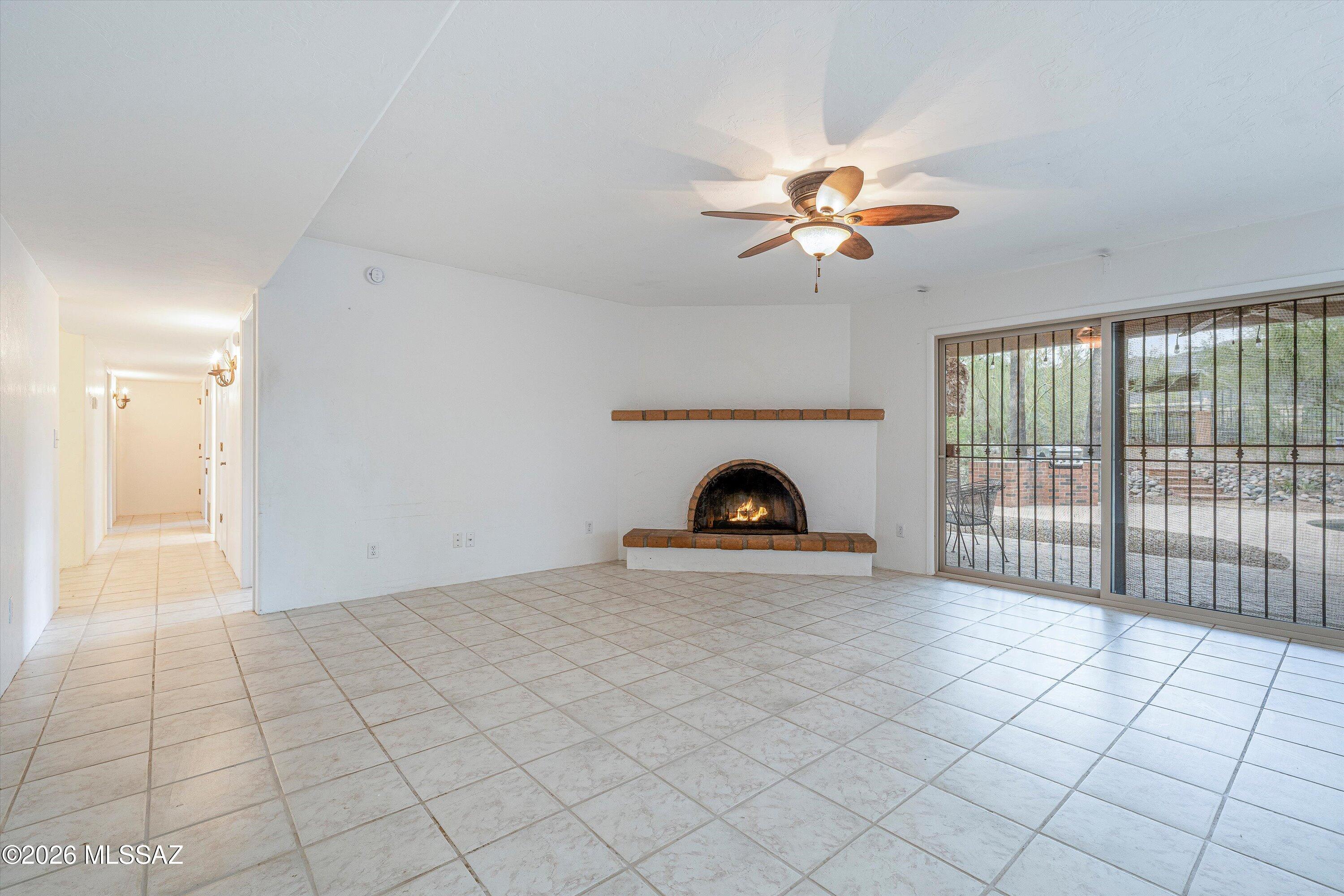 10961 East Roger Road Tucson, AZ 85749 - Photo 34 of 45 Family Room with sliders to back patio