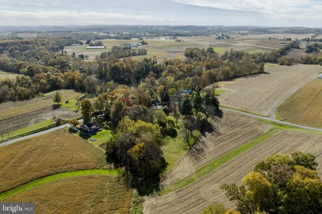 an aerial view of residential house with outdoor space
