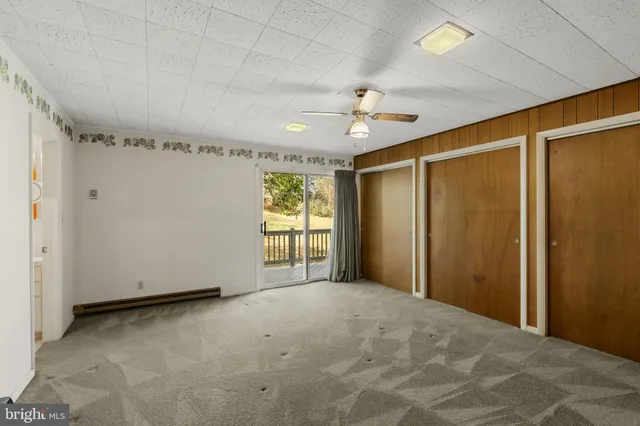 a view of an empty room with windows