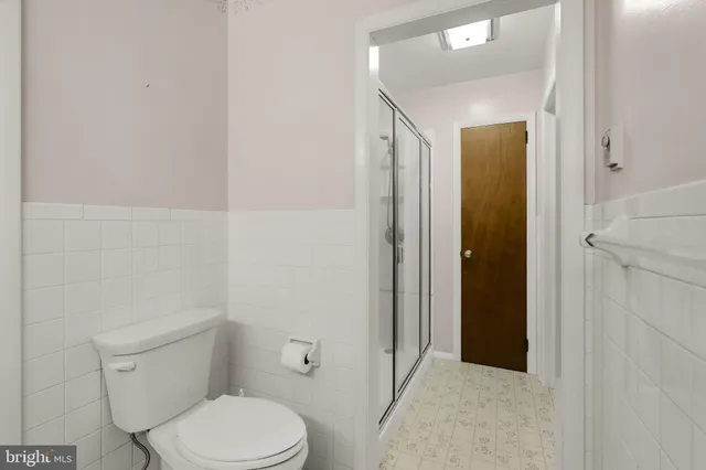 a room with a wooden floor and a fireplace