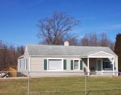 3326 Rutrough Road Southeast Roanoke, VA 24014 - Photo 1 of 1 a front view of a house with garden