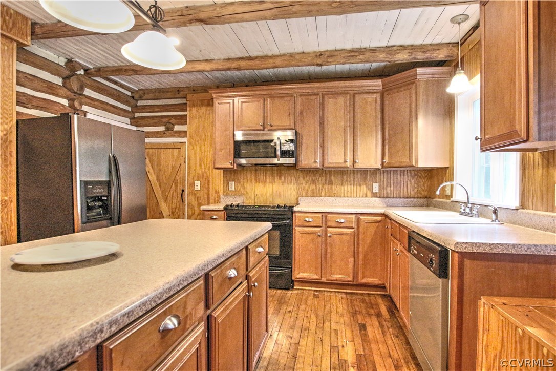 258 East Richmond Road Richmond, VA 23223 - Photo 14 of 40 a kitchen with a sink a stove and cabinets