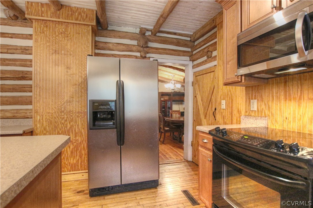 258 East Richmond Road Richmond, VA 23223 - Photo 15 of 40 a kitchen with stainless steel appliances granite countertop a refrigerator and a stove