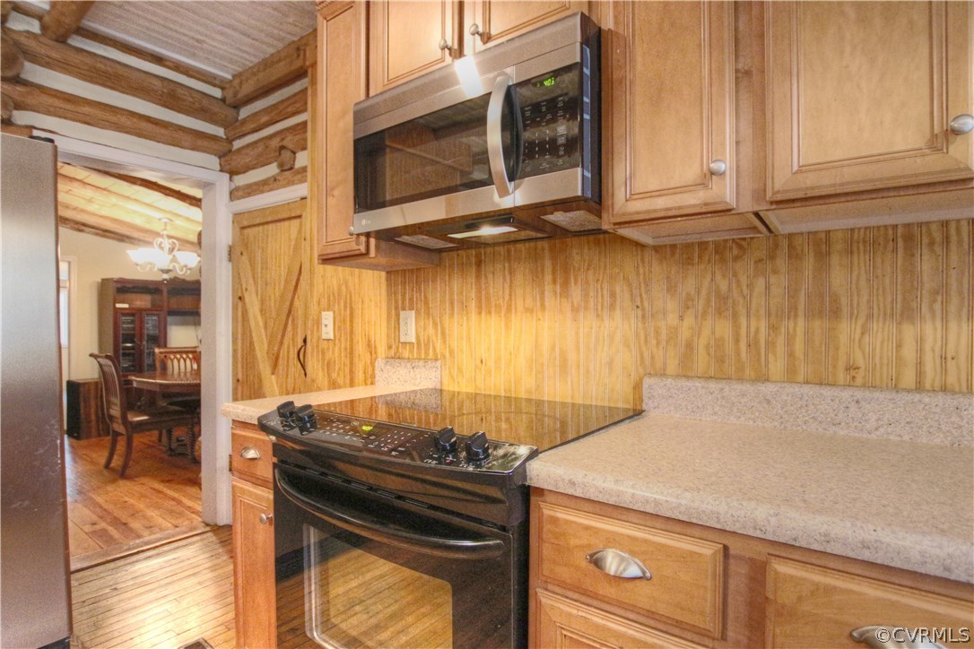 258 East Richmond Road Richmond, VA 23223 - Photo 16 of 40 a kitchen with a stove and a microwave