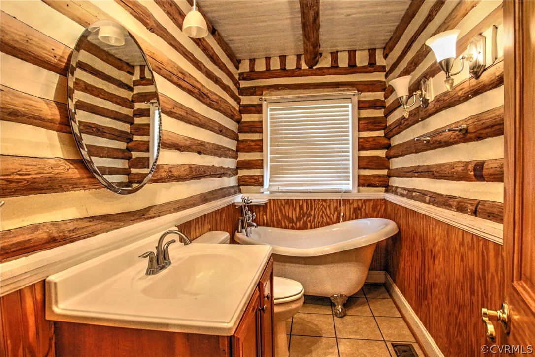 258 East Richmond Road Richmond, VA 23223 - Photo 5 of 40 a bathroom with a sink and a mirror