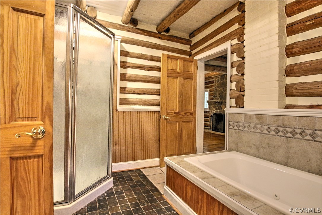 258 East Richmond Road Richmond, VA 23223 - Photo 8 of 40 a bathroom with a tub and shower