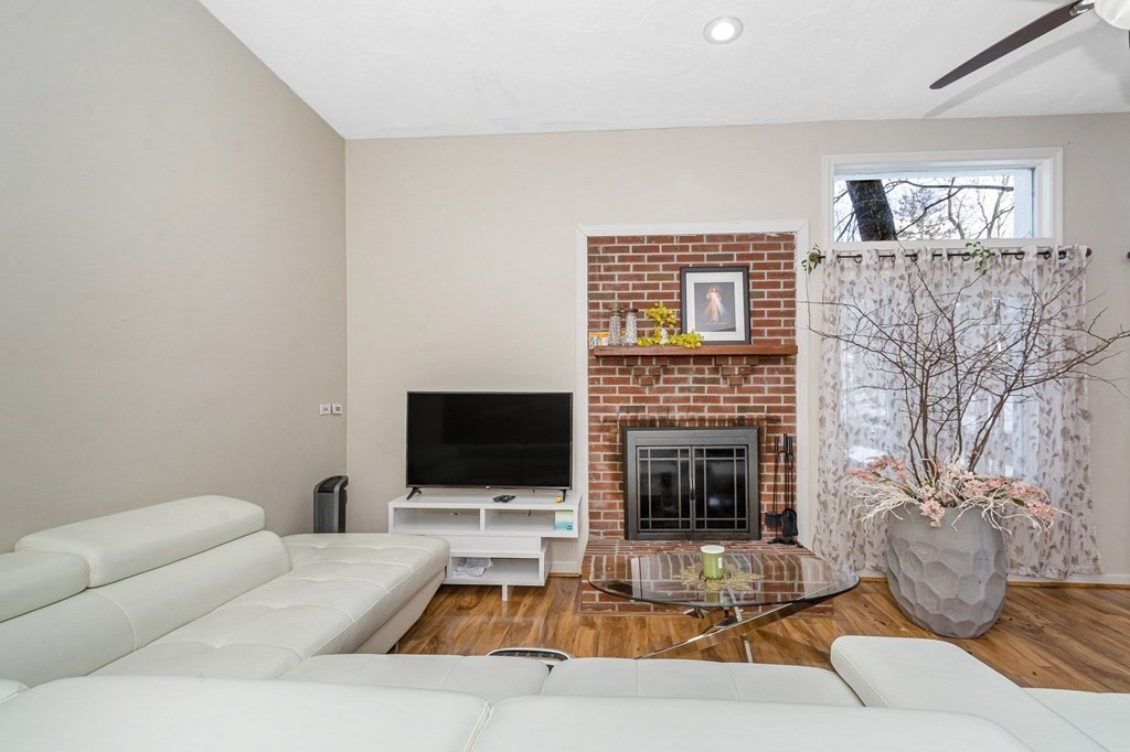 42 Epping Street, Unit 2 Lowell, MA 01852 - Photo 13 of 33 a living room with furniture and a fireplace
