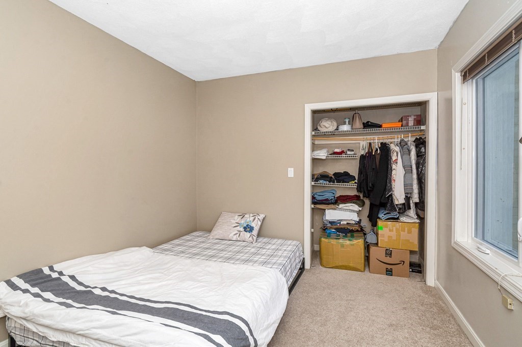 42 Epping Street, Unit 2 Lowell, MA 01852 - Photo 15 of 33 a bedroom with a bed and a window