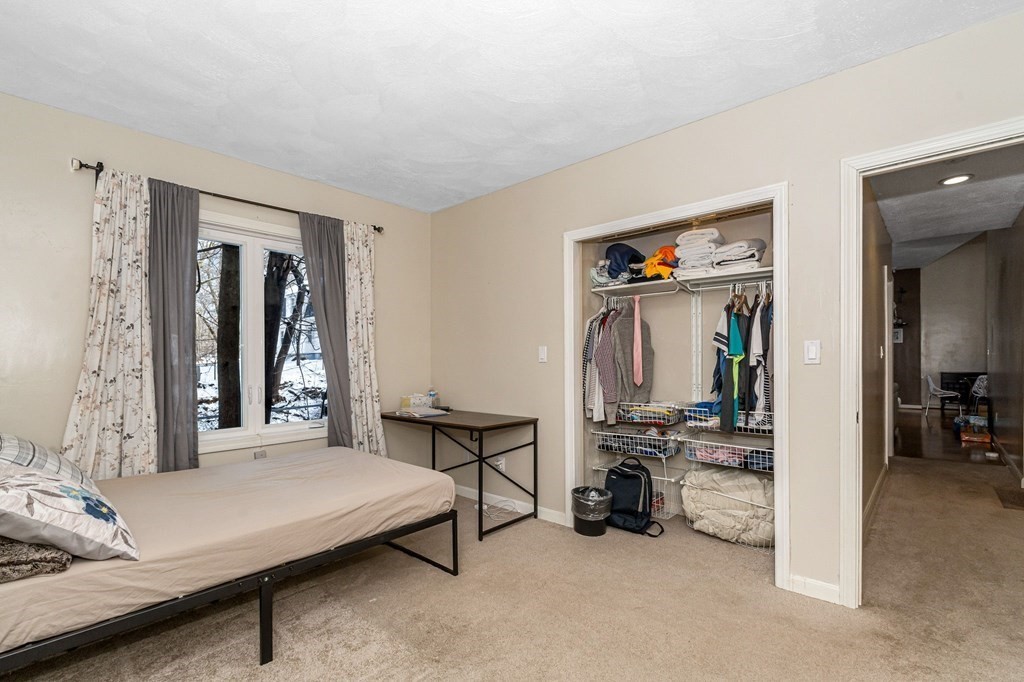 42 Epping Street, Unit 2 Lowell, MA 01852 - Photo 18 of 33 a bedroom with furniture and a window