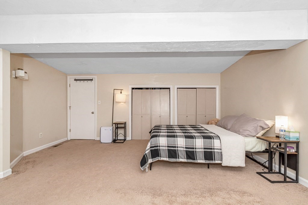 42 Epping Street, Unit 2 Lowell, MA 01852 - Photo 25 of 33 a bedroom with a bed and a window
