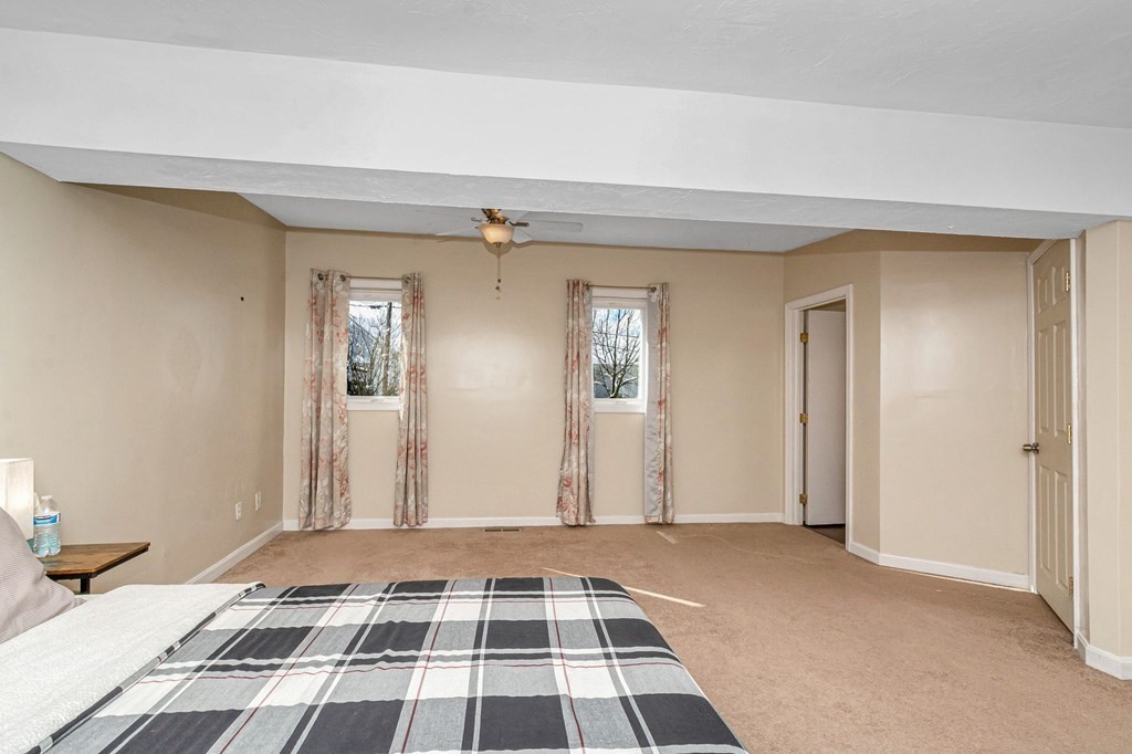 42 Epping Street, Unit 2 Lowell, MA 01852 - Photo 28 of 33 a bedroom with a bed and a window