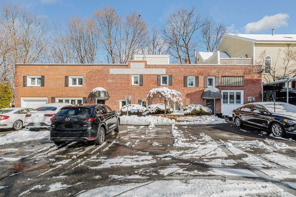 42 Epping Street, Unit 2 Lowell, MA 01852 - Photo 30 of 33 a car parked in front of a building