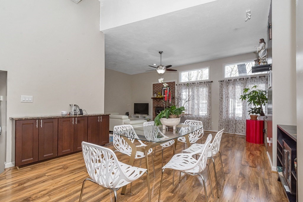 42 Epping Street, Unit 2 Lowell, MA 01852 - Photo 7 of 33 a view of a dining room with furniture and wooden floor