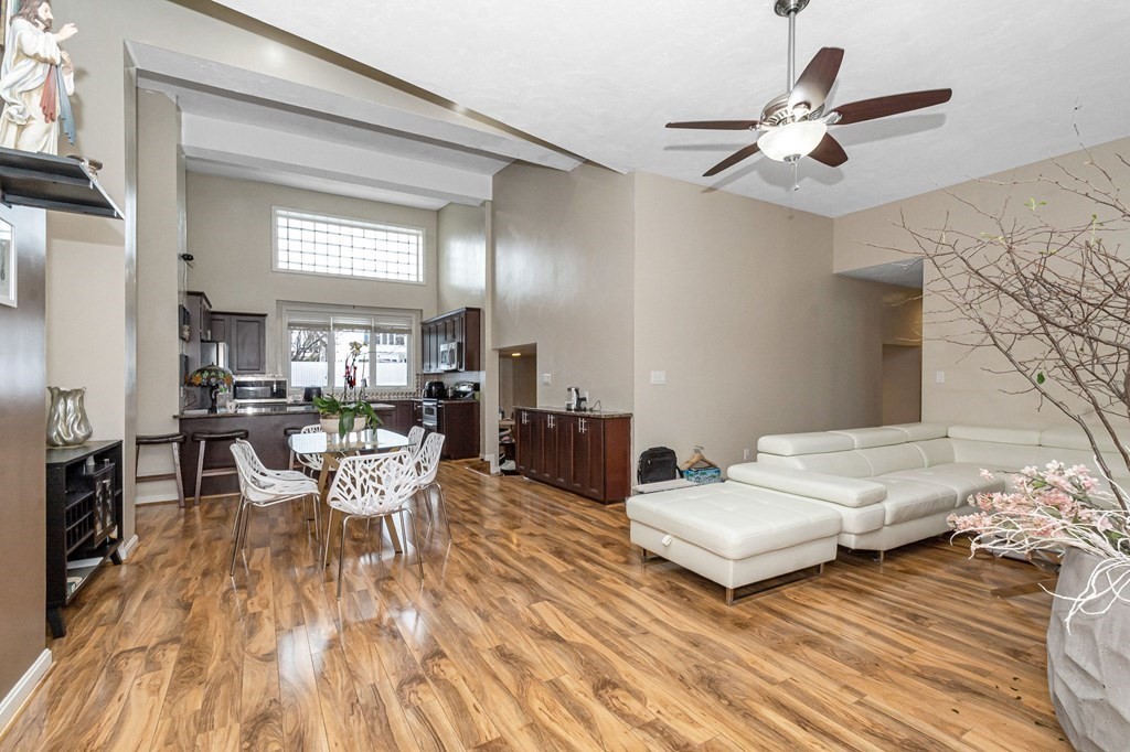 42 Epping Street, Unit 2 Lowell, MA 01852 - Photo 8 of 33 a living room with furniture and a wooden floor