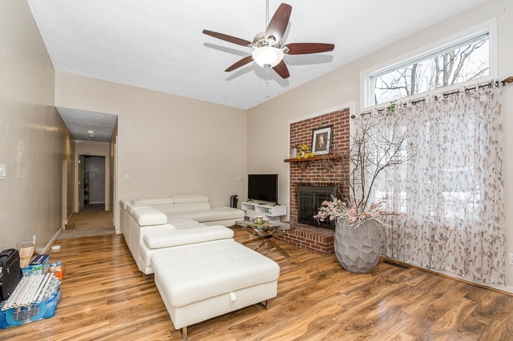 42 Epping Street, Unit 2 Lowell, MA 01852 - Photo 10 of 33 a living room with furniture and a fireplace