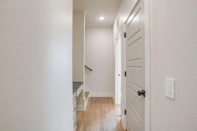 a bathroom with a granite countertop sink a toilet and mirror