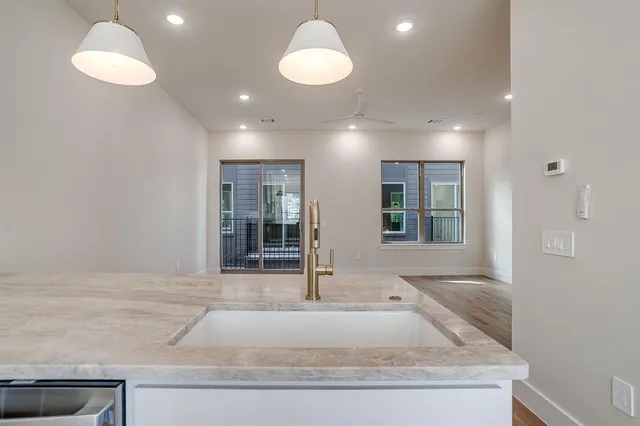 a view of an entryway with wooden floor