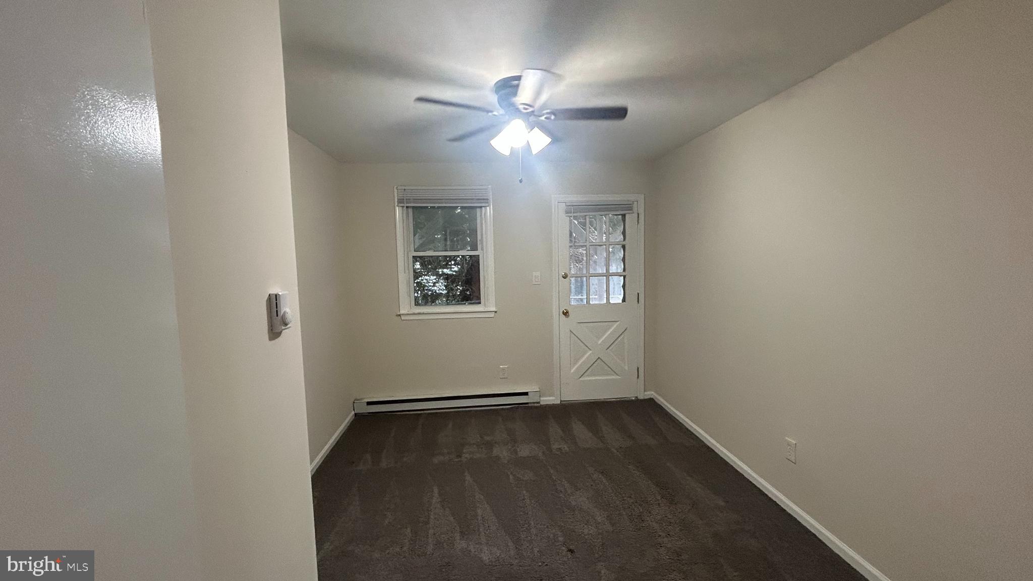 1022 Fox Chase Road, Unit B Jenkintown, PA 19046 - Photo 9 of 18 an empty room with a window and ceiling fan