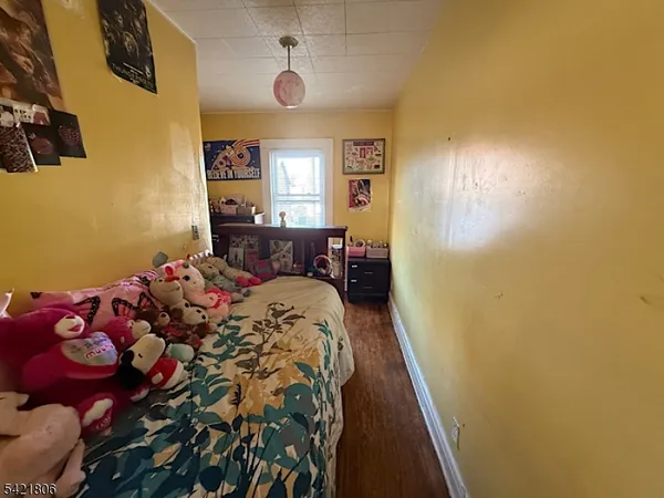 a bed room with a bed and a window