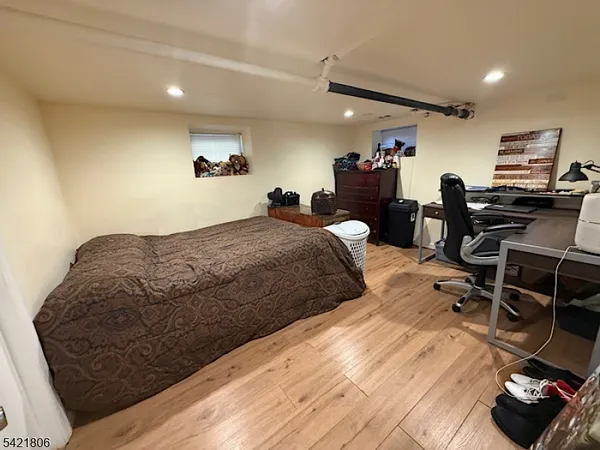 a bed room with a bed and a television