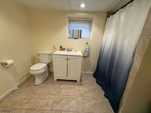 a bathroom with a toilet and a sink