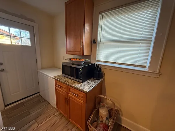 a kitchen with a stove and a window