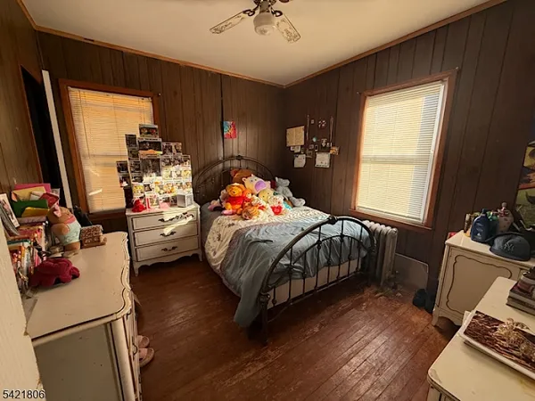 a bedroom with bed and a window