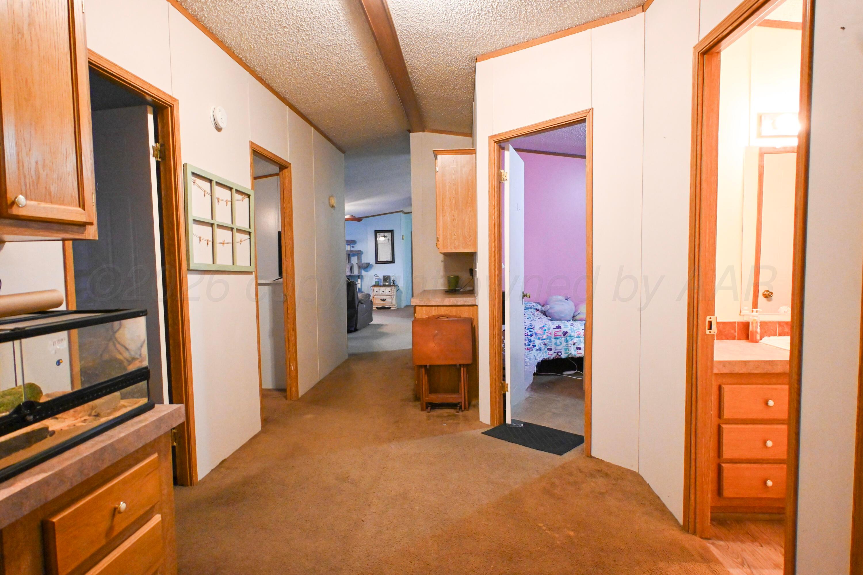 314 Cactus Road Borger, TX 79007 - Photo 22 of 28 a view of an empty room with a window