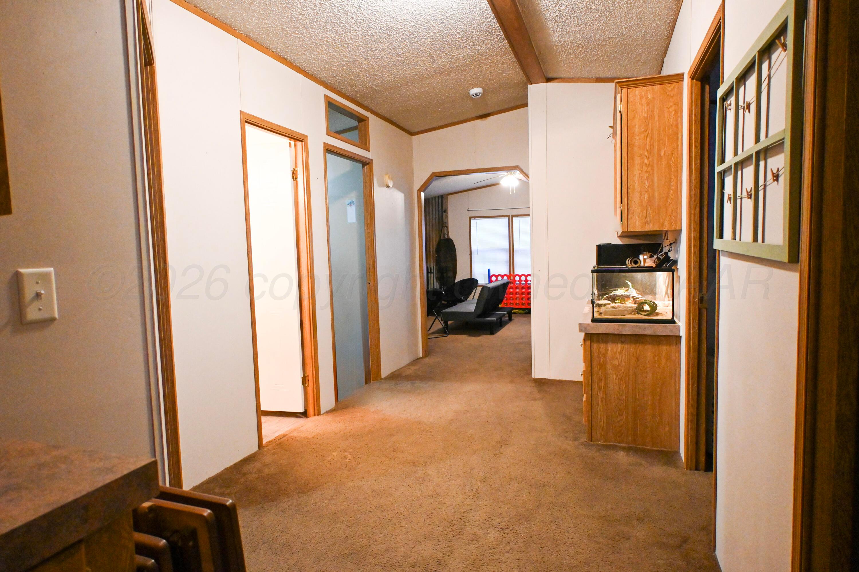 314 Cactus Road Borger, TX 79007 - Photo 23 of 28 a view of a hallway with workspace