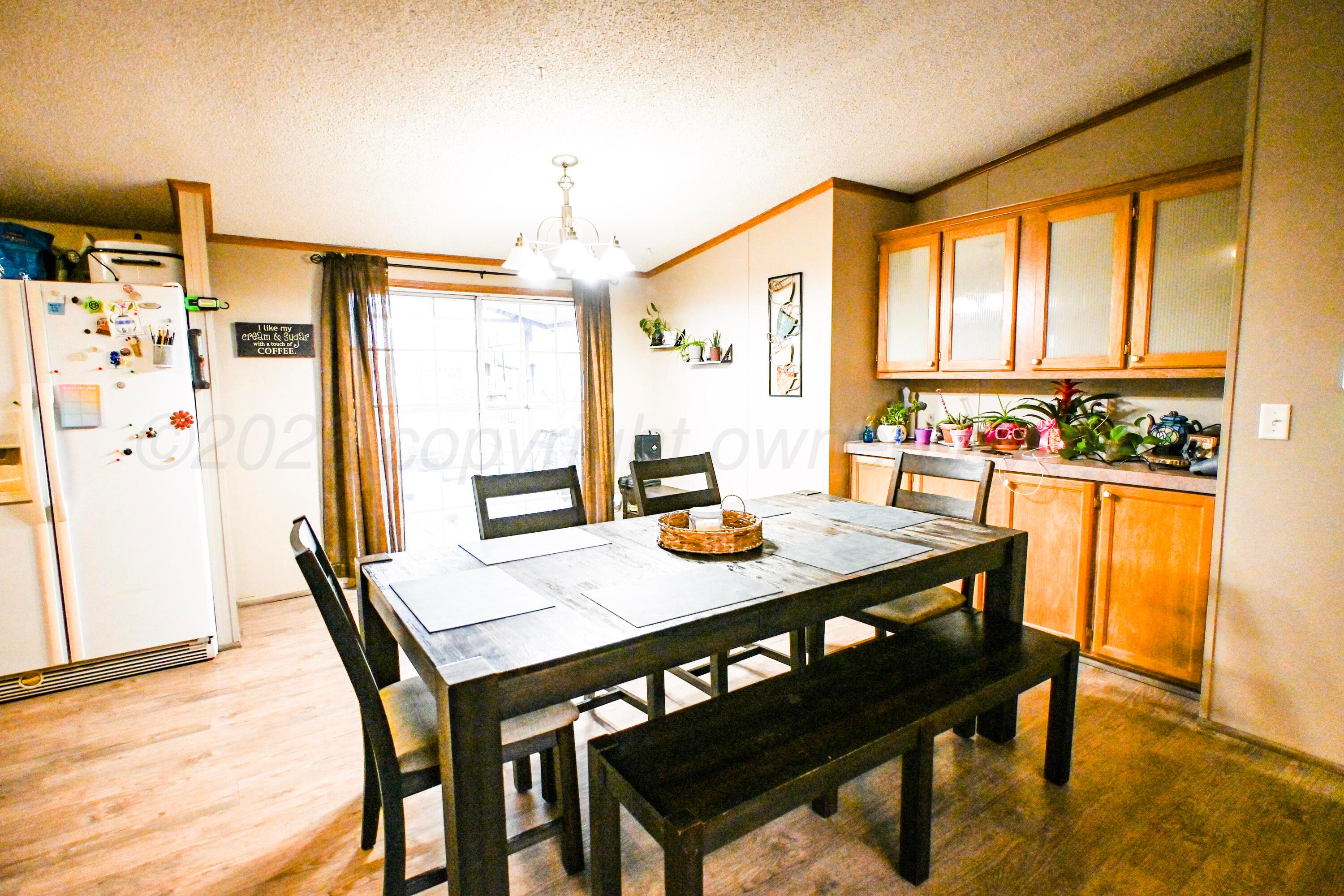 314 Cactus Road Borger, TX 79007 - Photo 8 of 28 a view of a dining room with furniture window and outside view