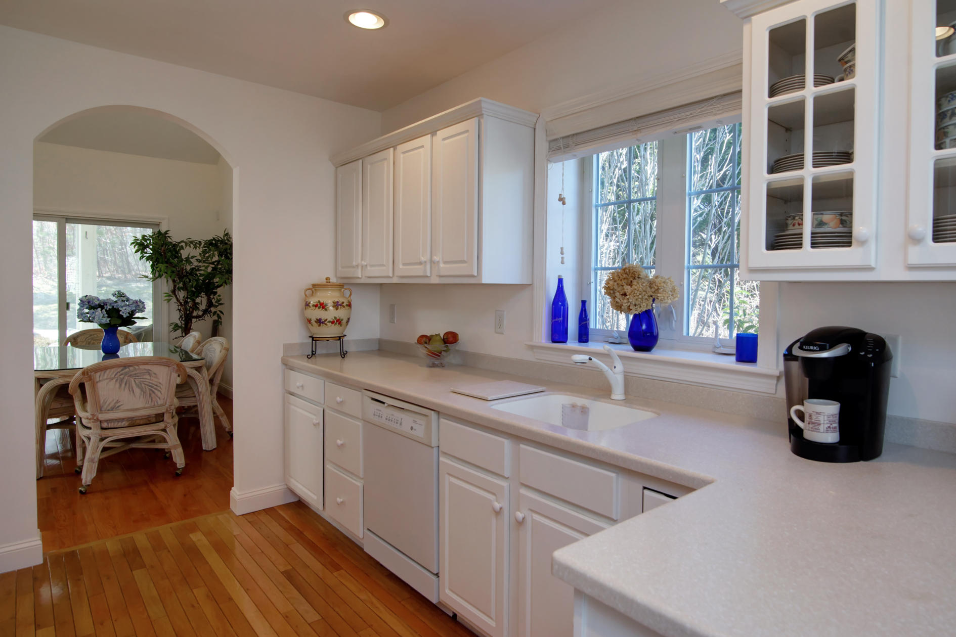 22 Stratford Ridge Mashpee, MA 02649 - Photo 11 of 35 a kitchen with a sink cabinets and wooden floor