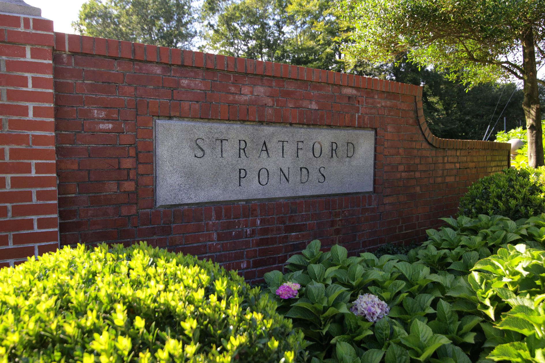 22 Stratford Ridge Mashpee, MA 02649 - Photo 29 of 35 a sign on the side of a building